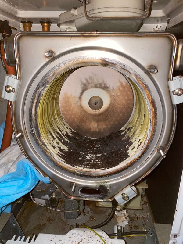 Heat exchanger before cleaning — shows why servicing matters
