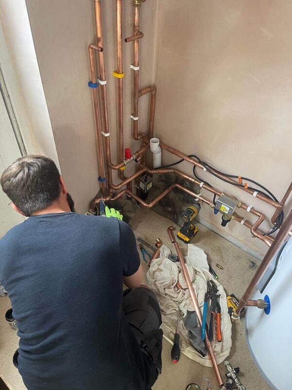 Mark working on copper pipework — Origin Heating